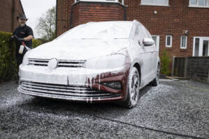 pre-wash stage of using a snow foam to clean the car 